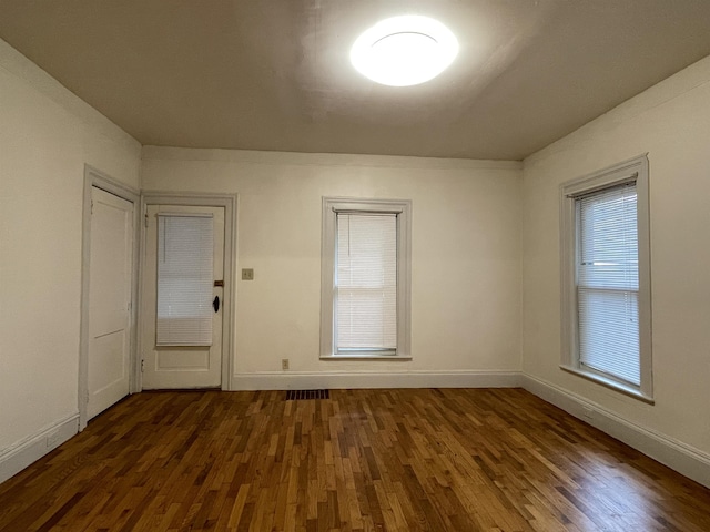 415 S Franklin, Mount Pleasant, MI 48858 - unfurnished room with dark wood-type flooring and baseboards