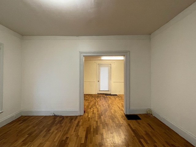 415 S Franklin, Mount Pleasant, MI 48858 - unfurnished room with wood finished floors and baseboards