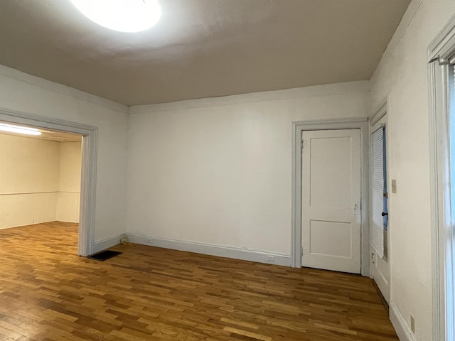 415 S Franklin, Mount Pleasant, MI 48858 - unfurnished bedroom with wood finished floors and baseboards