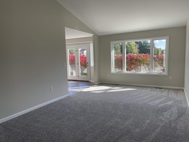 260 Windemere Pl, West Branch, MI 48661 - carpeted empty room with baseboards and lofted ceiling