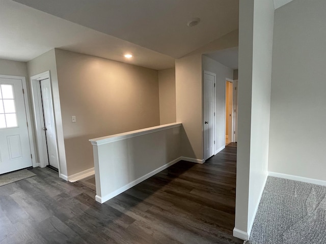 hall with dark hardwood / wood-style flooring