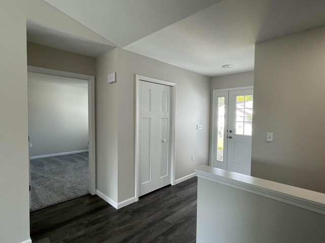 260 Windemere Pl, West Branch, MI 48661 - foyer entrance featuring baseboards and dark wood finished floors