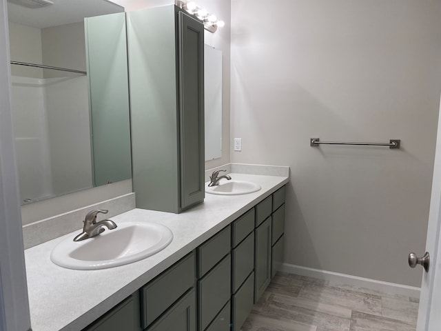 bathroom with hardwood / wood-style floors and vanity