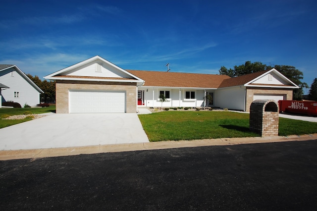 single story home featuring covered porch, a garage, and a front lawn