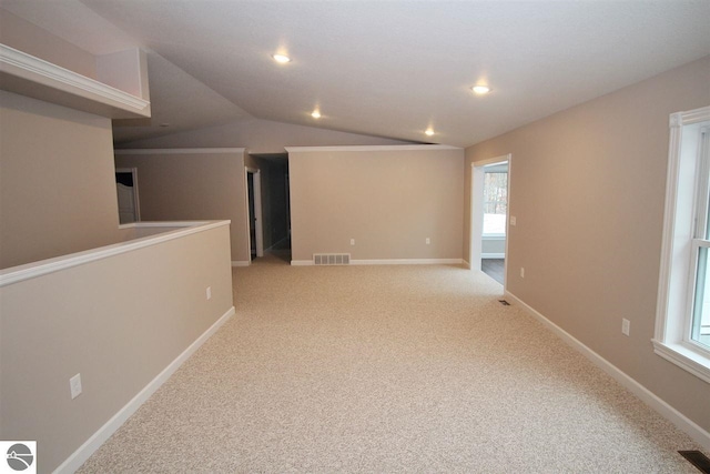 00 Sockeye Dr, Farwell, MI 48622 - spare room with light carpet, vaulted ceiling, baseboards, and recessed lighting
