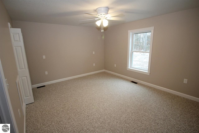 00 Sockeye Dr, Farwell, MI 48622 - unfurnished room featuring light colored carpet, ceiling fan, and baseboards