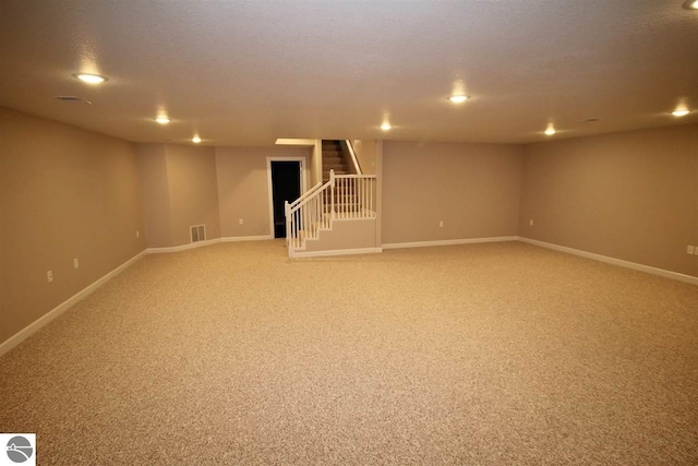00 Sockeye Dr, Farwell, MI 48622 - finished basement featuring light colored carpet, stairway, baseboards, and recessed lighting