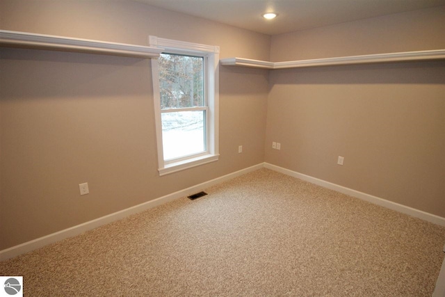00 Sockeye Dr, Farwell, MI 48622 - spare room with healthy amount of natural light, carpet, baseboards, and recessed lighting
