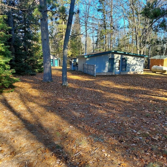 1400 Rainbow Park Trl, Luzerne, MI 48647 - view of property exterior with view of scattered trees