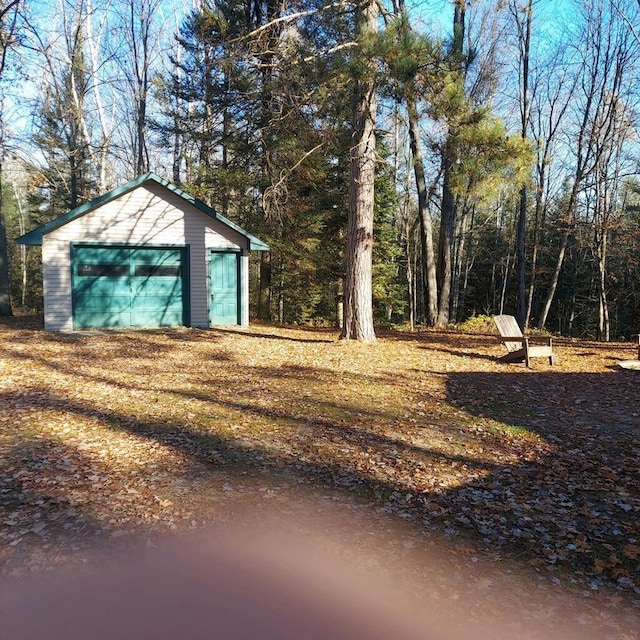 1400 Rainbow Park Trl, Luzerne, MI 48647 - view of yard featuring a garage and an outbuilding