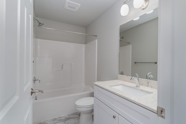 full bathroom featuring toilet, vanity, and tub / shower combination