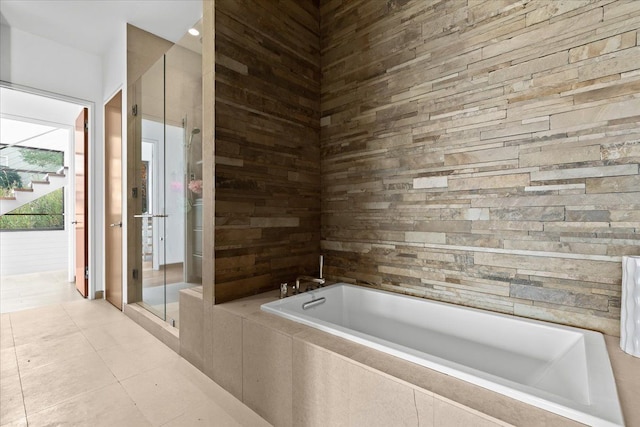 bathroom with tile patterned flooring and plus walk in shower