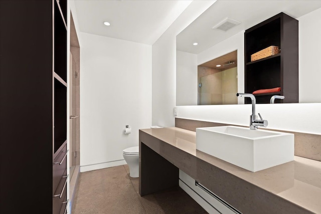 bathroom with a shower, vanity, and toilet