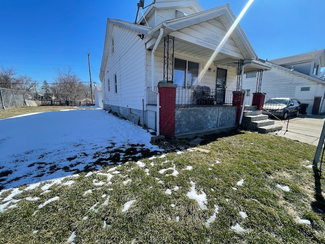 19312 Danbury St, Highland Park, MI 48203 - shotgun-style home featuring a porch