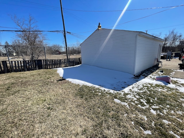 snow covered house featuring a lawn