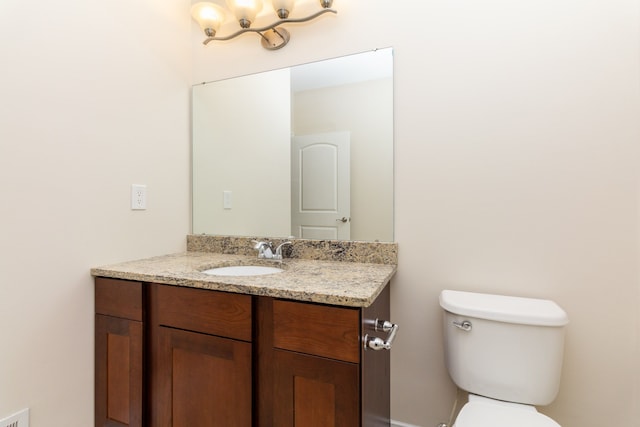 176 Sea Breeze Dr Unit 6, Detroit, MI 48214 - half bathroom with vanity, toilet, and a chandelier