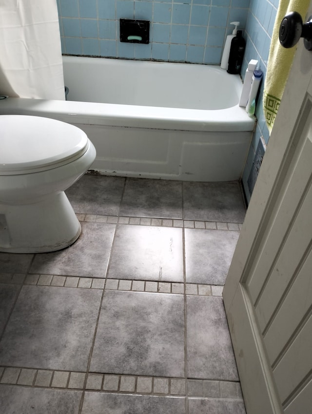 bathroom featuring tile patterned floors and toilet