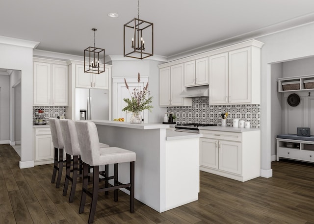 kitchen featuring a center island, stainless steel appliances, white cabinetry, and dark hardwood / wood-style floors