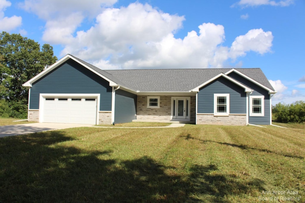 single story home with a front lawn and a garage