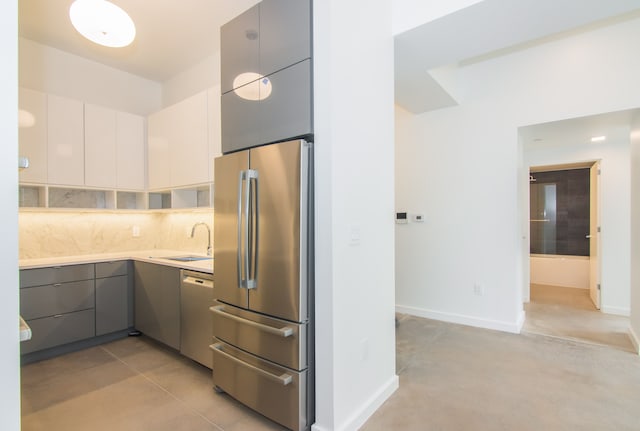 kitchen with gray cabinets, sink, white cabinets, and appliances with stainless steel finishes