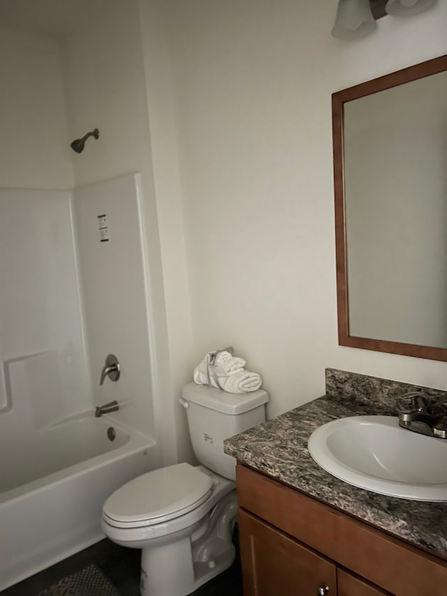 full bathroom featuring shower / tub combination, vanity, and toilet