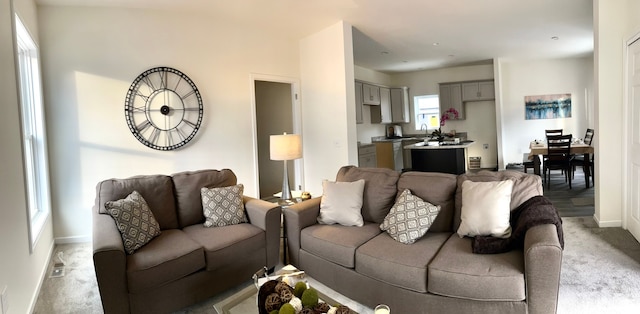 3075 Waukegan St, Auburn Hills, MI 48326 - living room with baseboards and light carpet