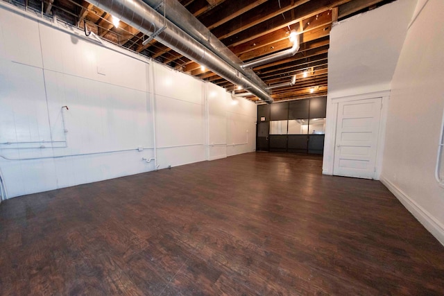 basement with dark wood-type flooring