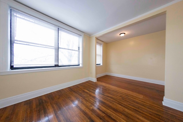 spare room featuring dark hardwood / wood-style floors