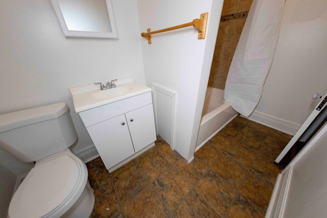 full bathroom with vanity, shower / tub combo, and toilet