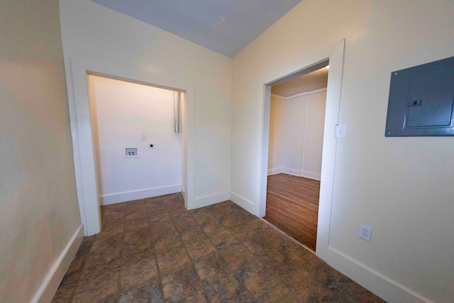 hall with dark hardwood / wood-style flooring and electric panel