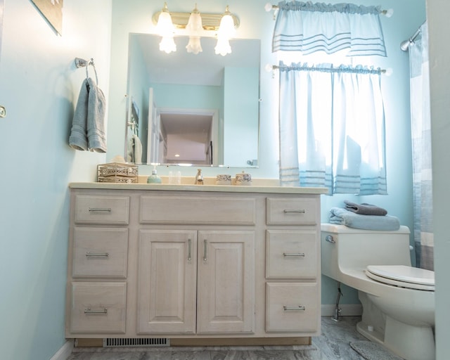 bathroom featuring a shower with curtain, vanity, a notable chandelier, and toilet