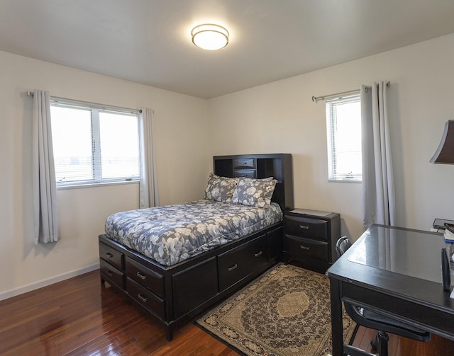 bedroom featuring dark hardwood / wood-style flooring