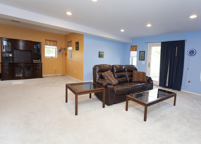 living room featuring light colored carpet