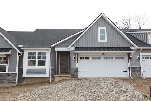 1031 Camellia Cir Unit 40, Howell, MI 48843 - view of front of home featuring a garage, a standing seam roof, board and batten siding, and stone siding