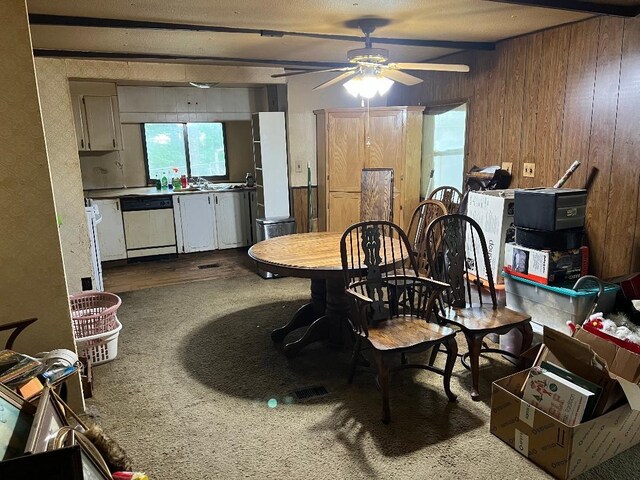 2520 Artist Ave, Interlochen, MI 49643 - dining area with a ceiling fan and wooden walls