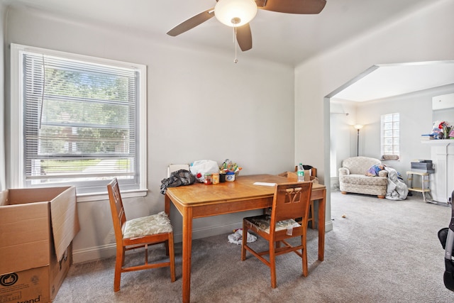 dining area with carpet flooring, ceiling fan, and plenty of natural light