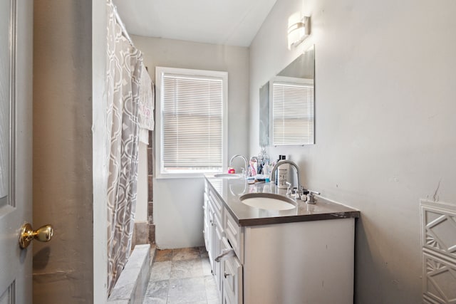 bathroom with vanity and walk in shower