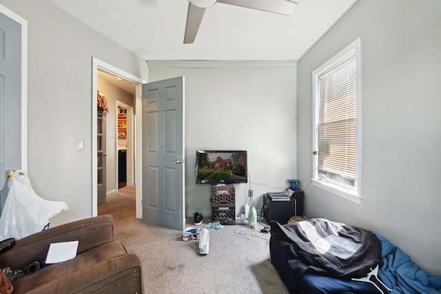 living room featuring crown molding, ceiling fan, light colored carpet, and lofted ceiling