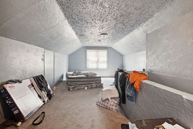 bedroom featuring carpet floors and vaulted ceiling