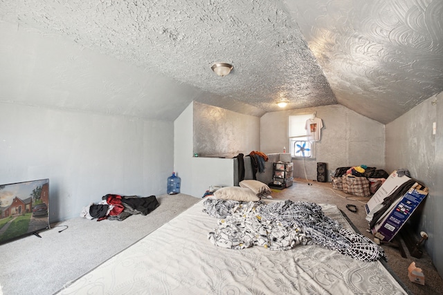 carpeted bedroom featuring a textured ceiling and vaulted ceiling