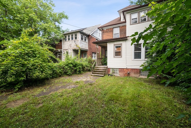 4443 Oregon St, Detroit, MI 48204 - back of house featuring a yard