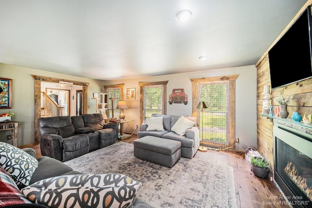 living room featuring a fireplace and hardwood / wood-style flooring