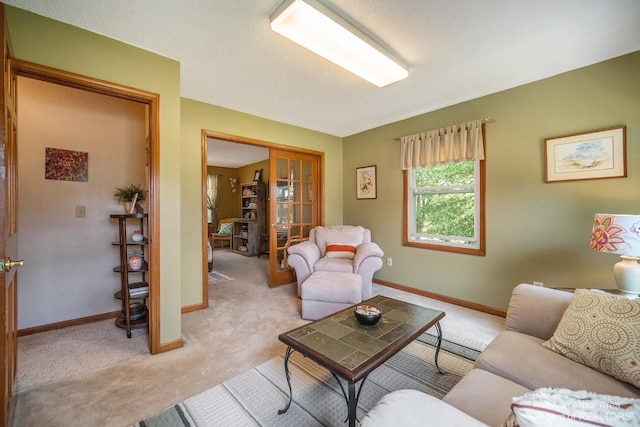 carpeted living room with a textured ceiling