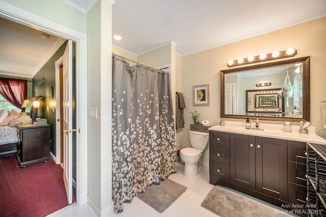 bathroom with tile patterned floors, a textured ceiling, toilet, vanity, and ornamental molding