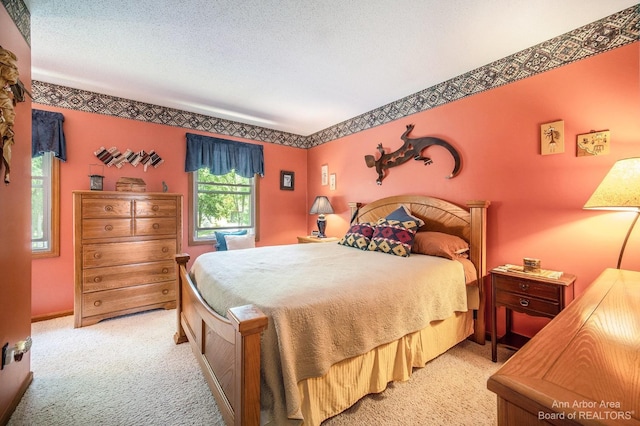 carpeted bedroom with a textured ceiling