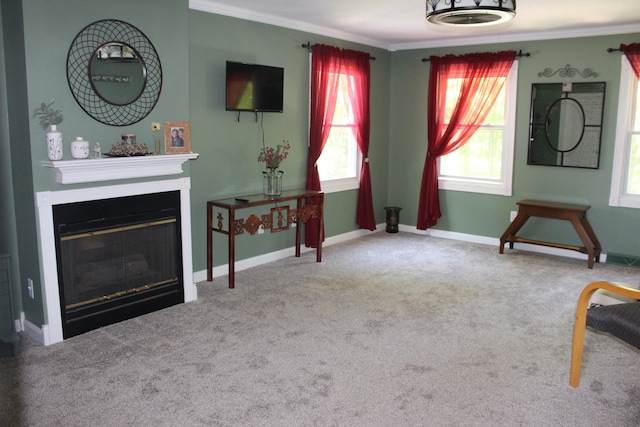 unfurnished living room with crown molding and carpet