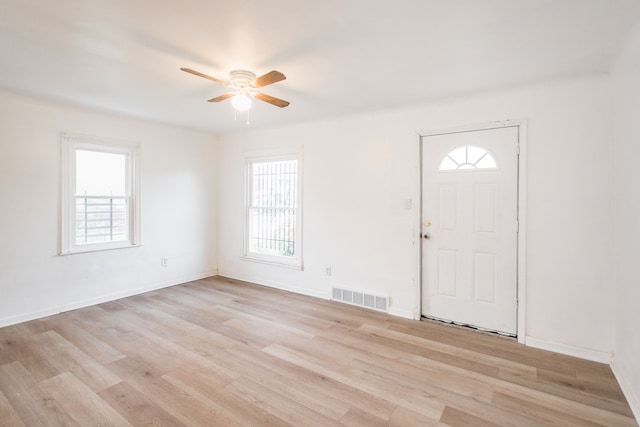 entrance foyer with ceiling fan, light wood-type flooring, and a wealth of natural light