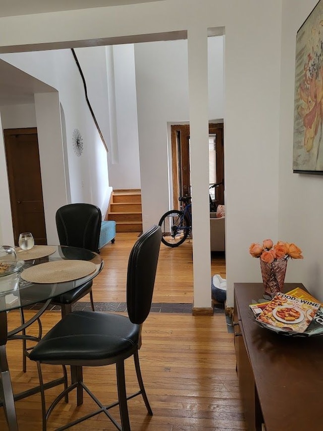 677 Selden St, Detroit, MI 48201 - dining space featuring light wood finished floors and stairway