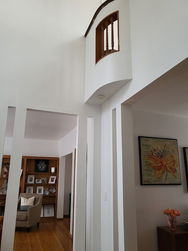 677 Selden St, Detroit, MI 48201 - corridor featuring wood finished floors and a high ceiling