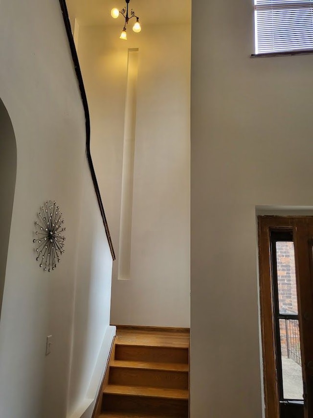 677 Selden St, Detroit, MI 48201 - stairs featuring arched walkways and wood finished floors